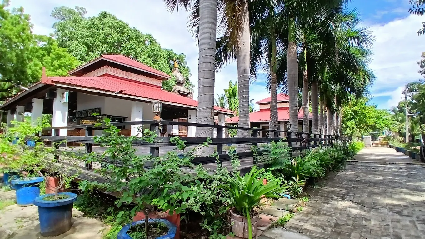 Palm-lined garden grounds and teak pavilions at the Diamond Palace Meiktila Hotel
